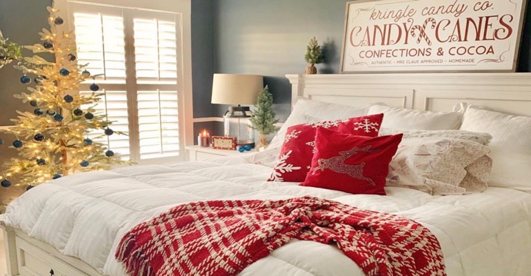 Traditional bedroom with Christmas tree.
